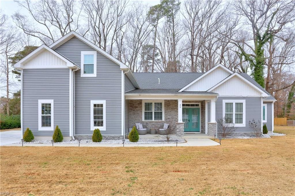 49 Normandy Ln, Newport News, VA 23606 - back of house with a lawn, board and batten siding, and stone siding