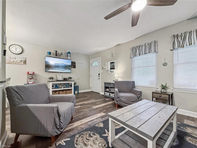 living room with dark hardwood / wood-style floors and ceiling fan