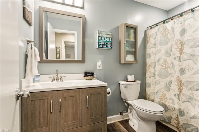 full bathroom with wood-type flooring, vanity, toilet, and shower / bath combination with curtain