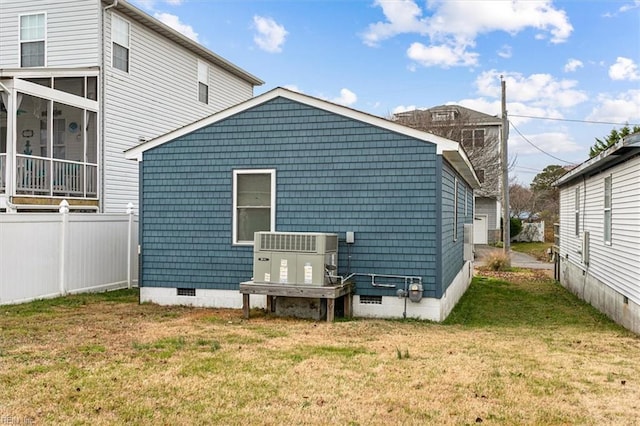 view of property exterior featuring a yard and central AC unit