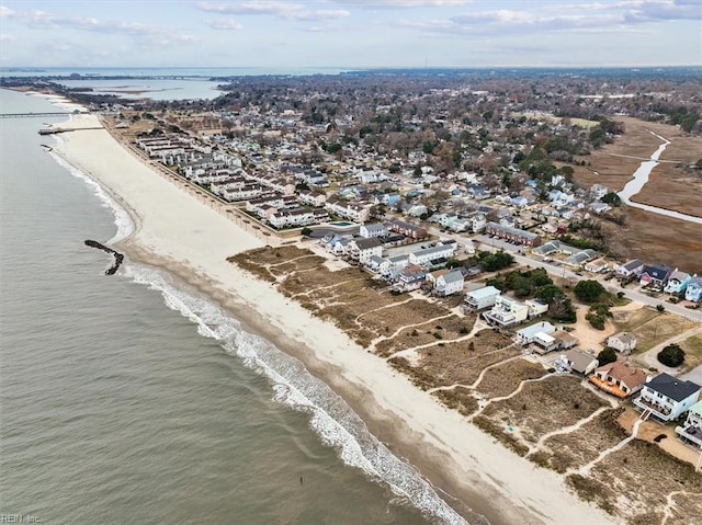 drone / aerial view with a water view and a view of the beach