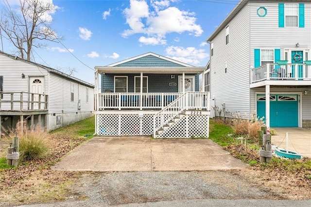 view of front of house featuring covered porch and a garage