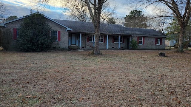 ranch-style house with a front lawn