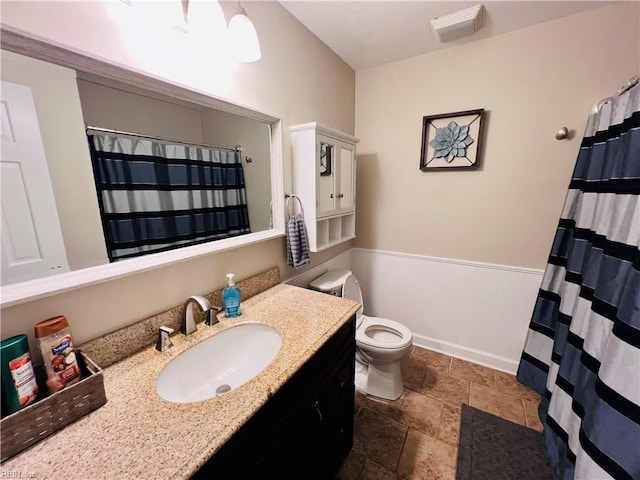 bathroom with vanity and toilet