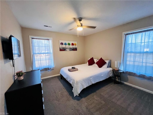 bedroom featuring dark colored carpet and ceiling fan