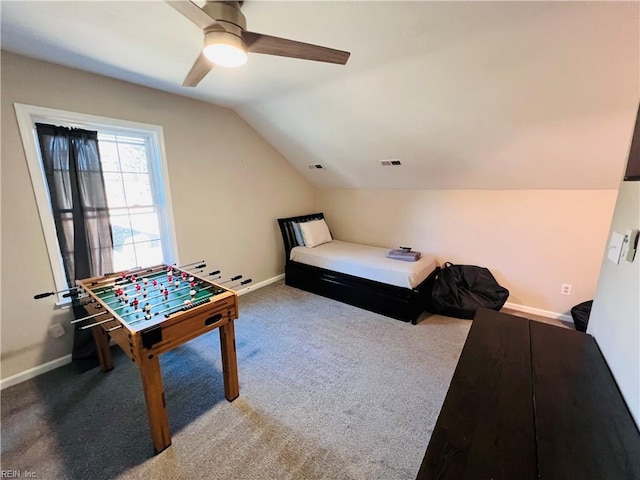 carpeted bedroom featuring ceiling fan and vaulted ceiling