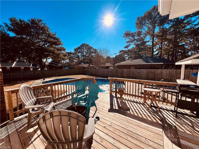 deck with a fenced in pool