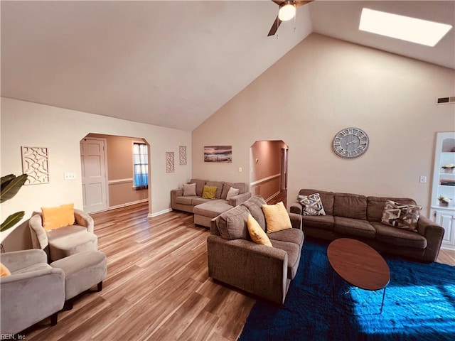 living room featuring ceiling fan, lofted ceiling, and hardwood / wood-style flooring