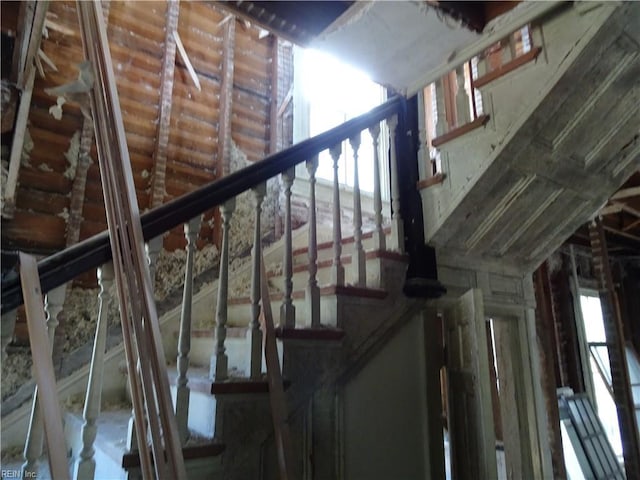 staircase with vaulted ceiling