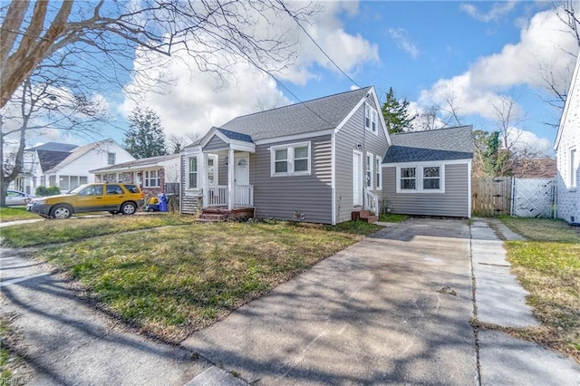 bungalow-style home featuring a front yard