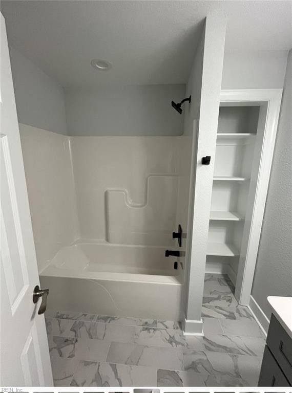 bathroom with shower / bathing tub combination and vanity