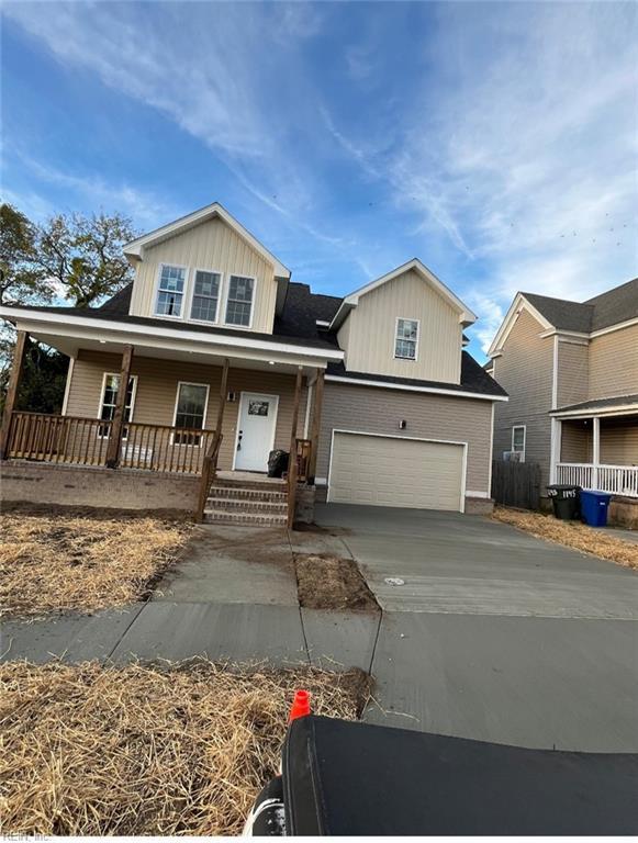 view of front of home featuring covered porch and a garage