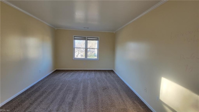 spare room featuring crown molding and dark colored carpet