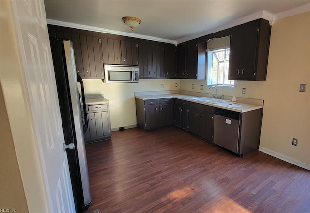 kitchen featuring dark hardwood / wood-style flooring, sink, and appliances with stainless steel finishes