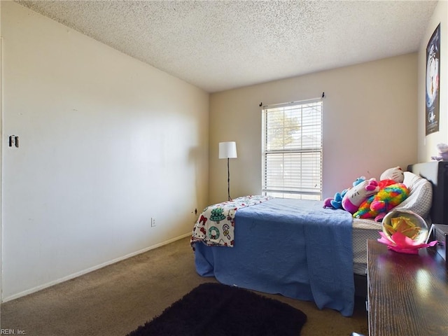 carpeted bedroom with a textured ceiling