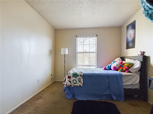 carpeted bedroom featuring a textured ceiling