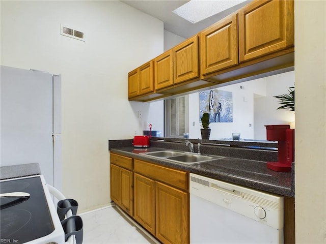 kitchen with white appliances and sink