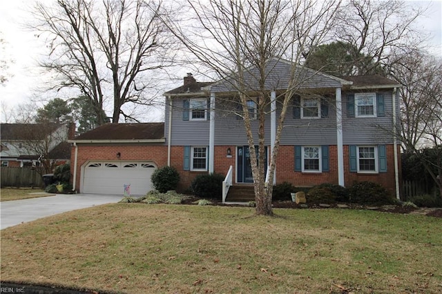 view of front of home with a garage and a front lawn