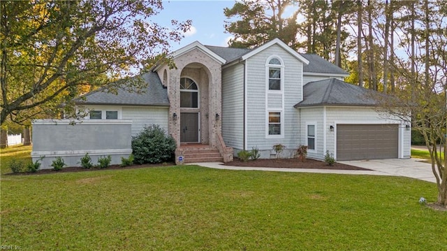 view of front facade featuring a garage and a front lawn