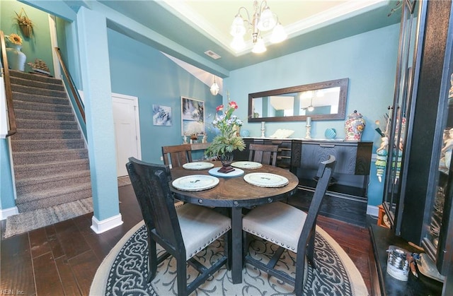 dining room featuring lofted ceiling and a chandelier