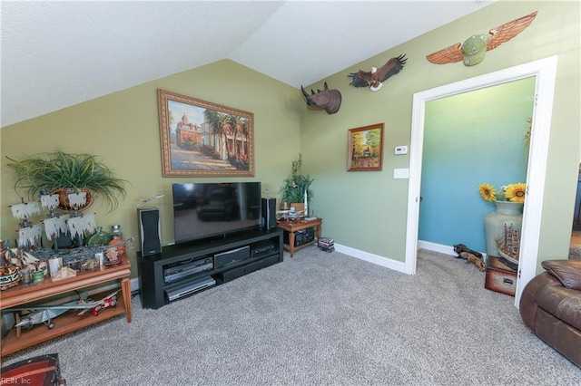 carpeted living area featuring baseboards and vaulted ceiling