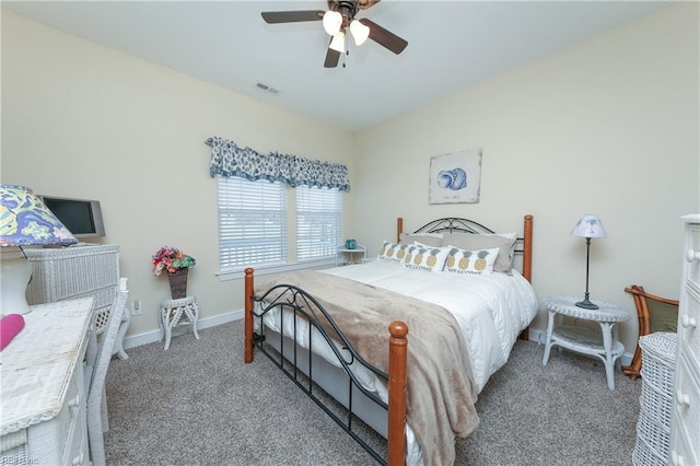 bedroom with visible vents, baseboards, carpet, and ceiling fan