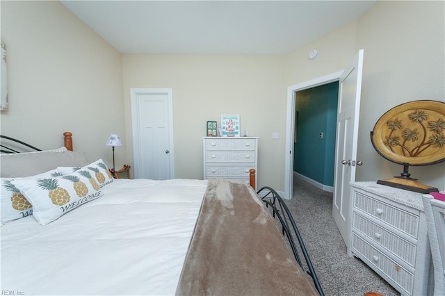 carpeted bedroom featuring baseboards