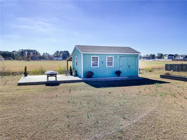 exterior space featuring an outbuilding and a front lawn