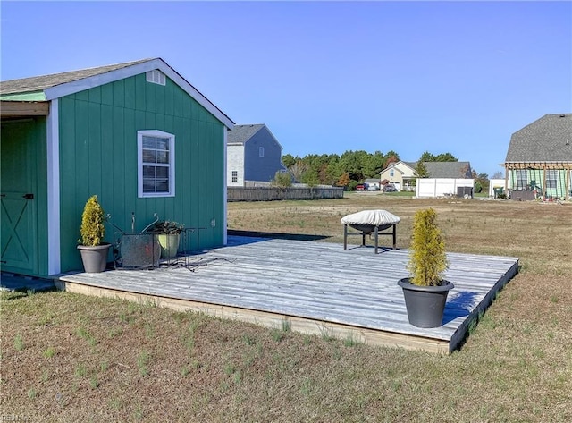 view of outbuilding with a yard