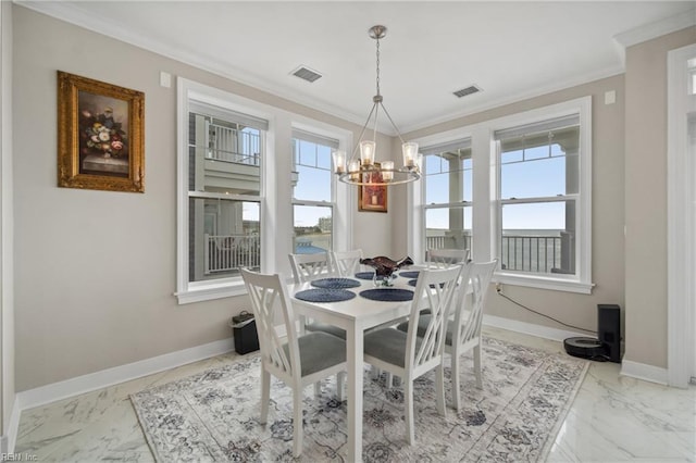 dining area with a chandelier and ornamental molding