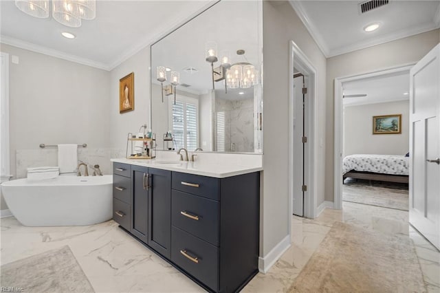 bathroom featuring a bathing tub, vanity, ornamental molding, and an inviting chandelier