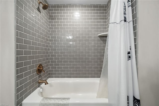 bathroom with shower / bath combination with curtain