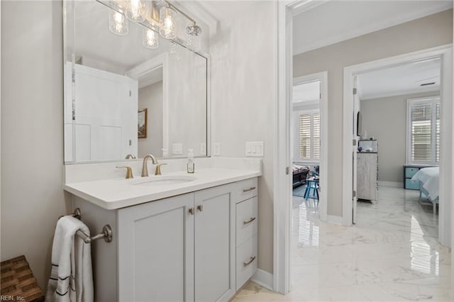 bathroom featuring vanity, crown molding, and an inviting chandelier