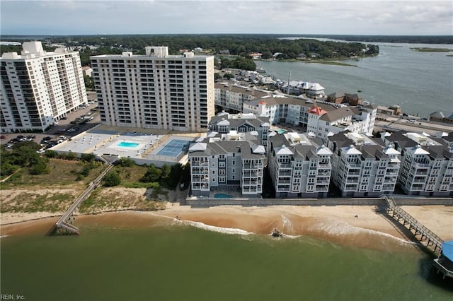 bird's eye view featuring a water view and a beach view