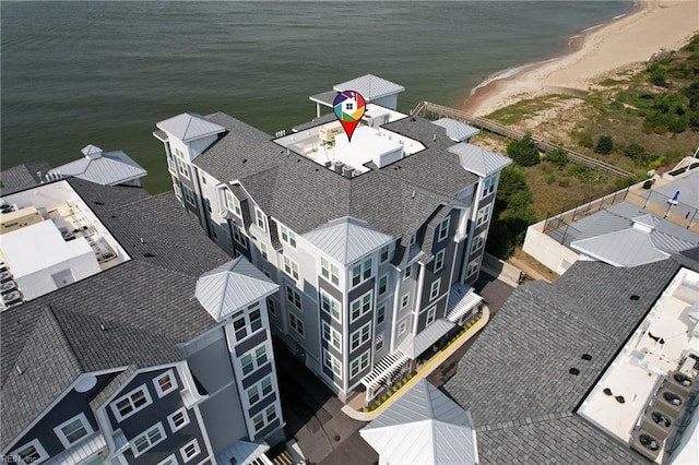 drone / aerial view with a water view and a view of the beach