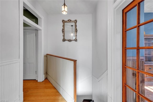 corridor featuring light hardwood / wood-style floors