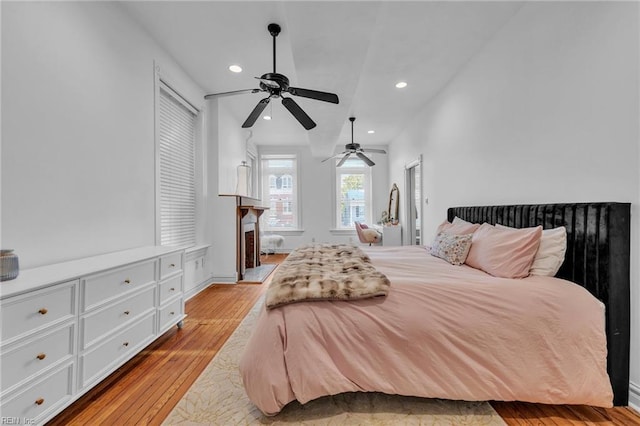 bedroom featuring ceiling fan and light hardwood / wood-style flooring