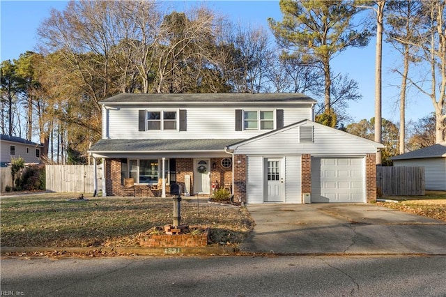 view of front property featuring a garage and a front lawn