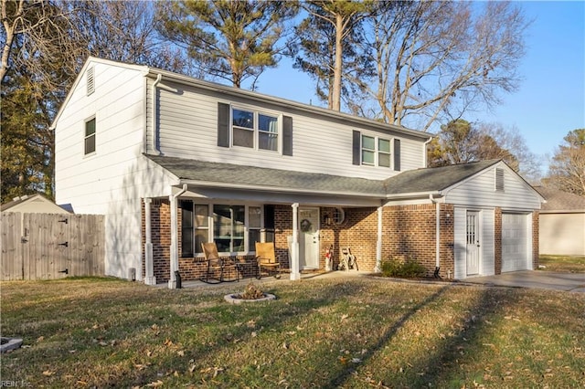 view of front of house featuring a garage and a front yard