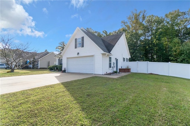 view of front facade with a front yard and a garage