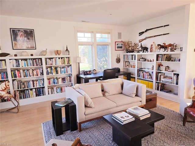 sitting room featuring wood-type flooring