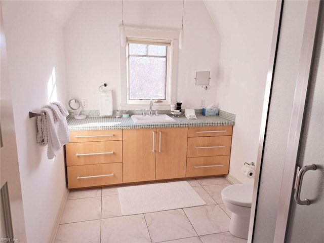 bathroom with tile patterned floors, vanity, and toilet