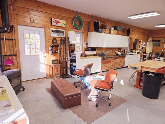 interior space with a workshop area and wooden walls