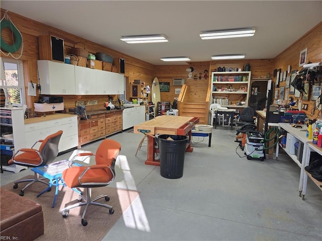 interior space featuring a workshop area and wood walls