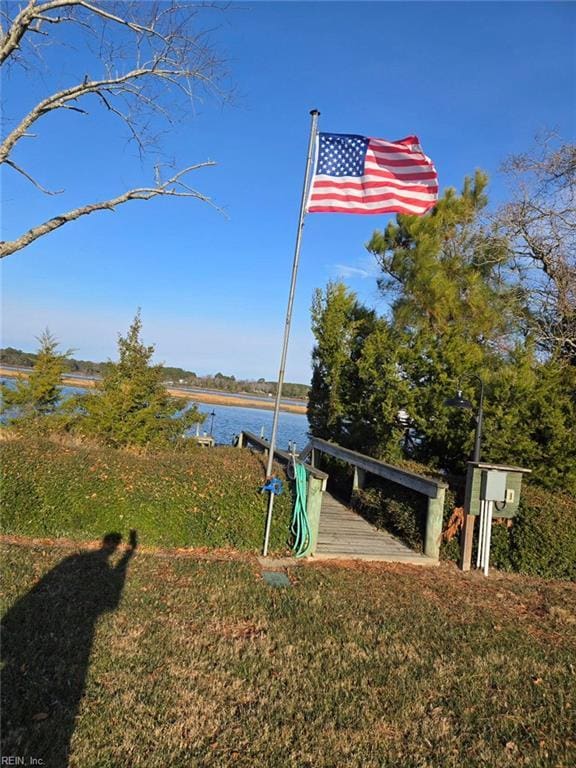 view of home's community with a water view