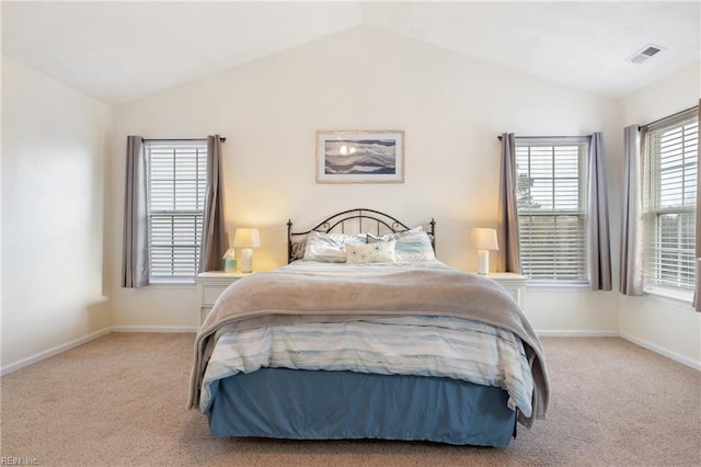 carpeted bedroom featuring vaulted ceiling