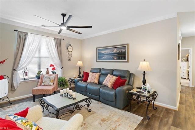 living room with ceiling fan, wood-type flooring, and ornamental molding