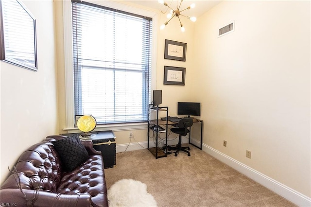 carpeted office featuring an inviting chandelier