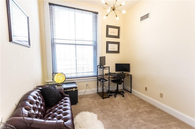 carpeted office with a chandelier