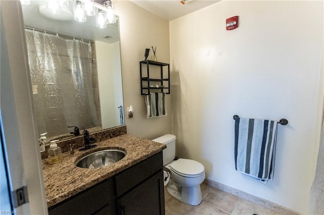 bathroom featuring tile patterned floors, vanity, toilet, and a shower with curtain